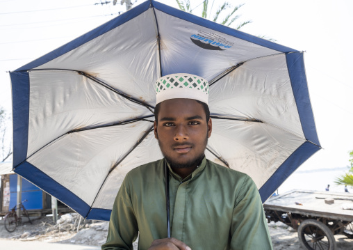 Portrait of a bangladeshi muslim man with an umbrella, Khulna Division, Shyamnagar, Bangladesh