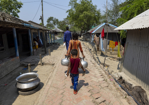 Bangladeshi girl going to collect water in Sundarbans, Khulna Division, Shyamnagar, Bangladesh