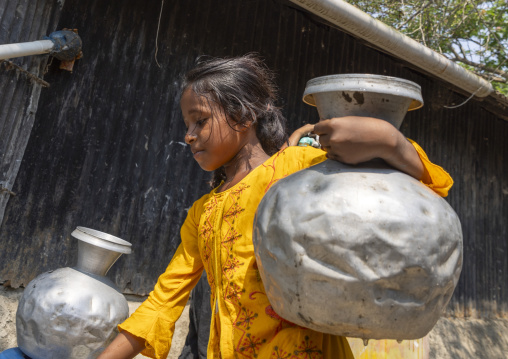 Bangladeshi girl carrying water in a jar, Khulna Division, Shyamnagar, Bangladesh