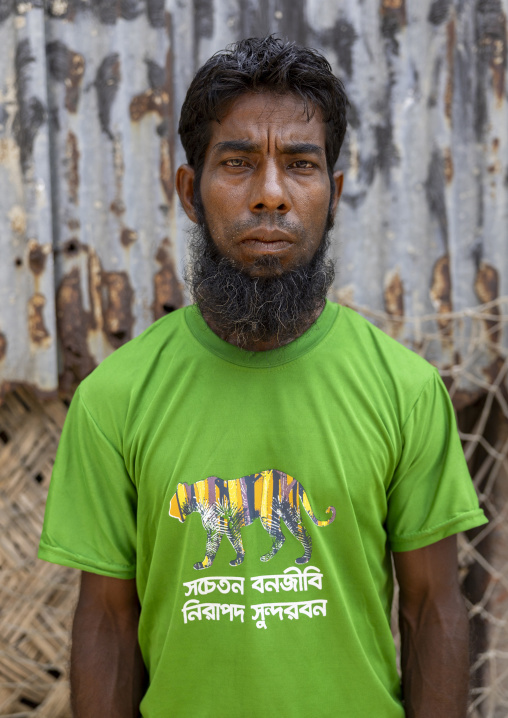 Portrait of a bangladeshi man with a tiger shirt in Sundarbans, Khulna Division, Shyamnagar, Bangladesh