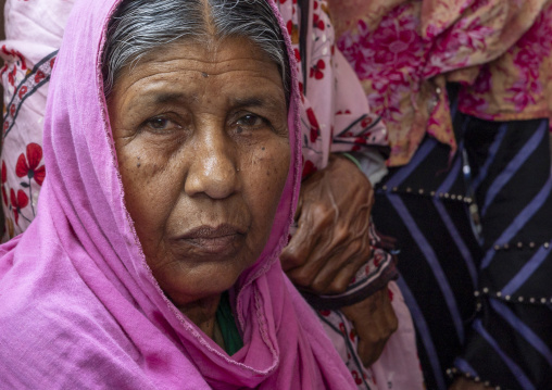 Portrait of a woman who lost her husband killed by tiger, Khulna Division, Shyamnagar, Bangladesh