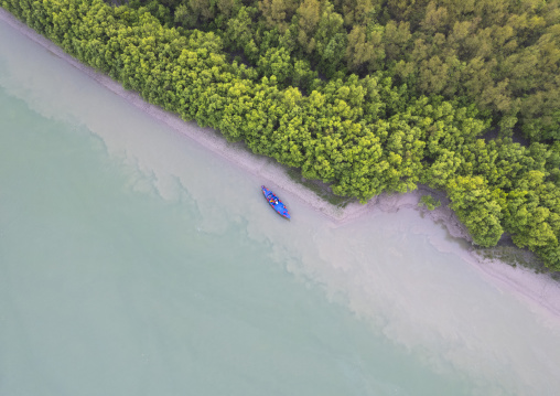 Aerial view of a boat near the mangrove in the Sundarbans, Khulna Division, Shyamnagar, Bangladesh