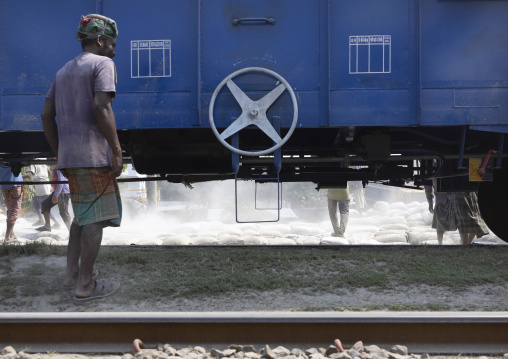 Bangladeshi workers unloading cement bags from a train, Khulna Division, Abhaynagar, Bangladesh