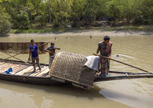 Bangladeshi fishermen use otters to fish in the Sundarbans, Khulna Division, Narail Sadar, Bangladesh