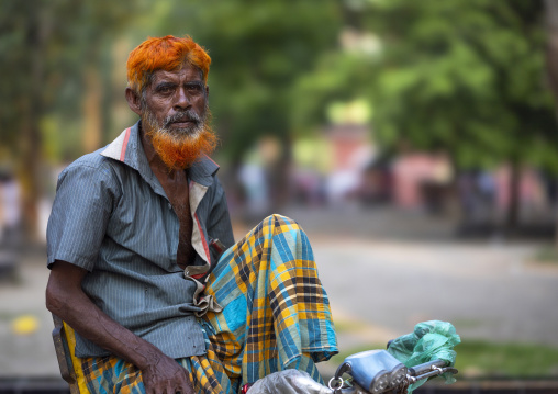 Portrait of a bangladeshi man with a beard dyed in henna, Khulna Division, Jessore, Bangladesh