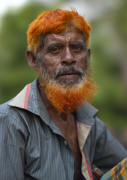 Portrait of a bangladeshi man with a beard dyed in henna, Khulna Division, Jessore, Bangladesh