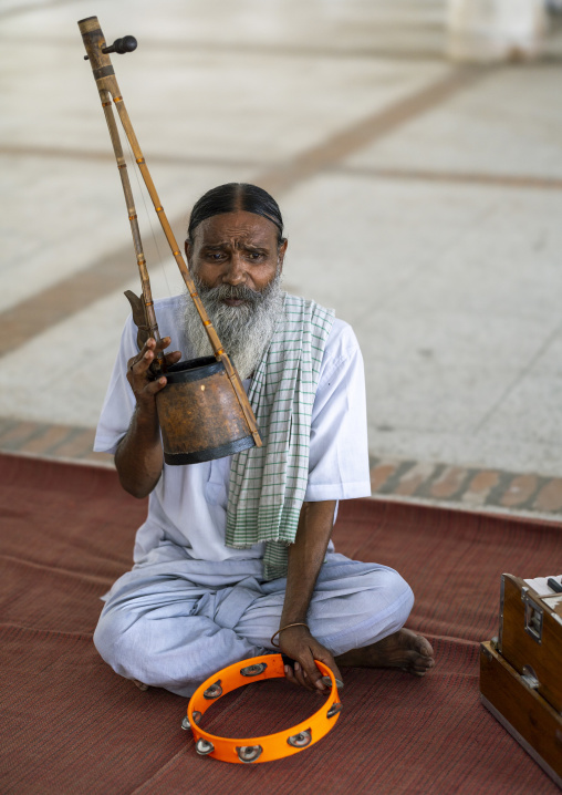 Devotee playing music in Mausoleum of Lalon Shah, Khulna Division, Cheuriya, Bangladesh