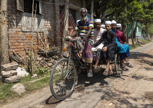 Bangladeshi muslim boys on a rickshaw, Rajshahi Division, Puthia, Bangladesh