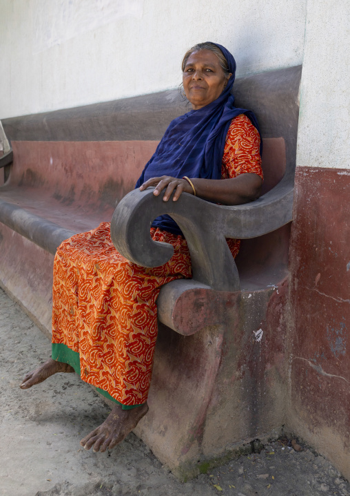 Portrait of a woman sit on a bench, Rajshahi Division, Manda, Bangladesh