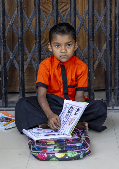 Bangladeshi boy in a religious school in an hindu temple