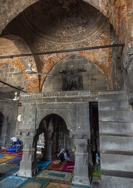 Bangladeshi muslim man sit inside Kusumba mosque, Naogaon District, Manda Upazila, Bangladesh