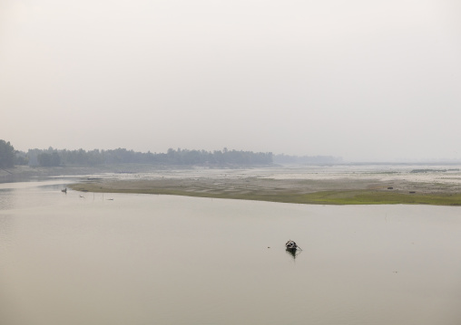 Local boat on a quiet river, Rajshahi Division, Sariakandi, Bangladesh