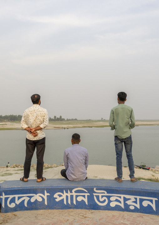 Rear view of bangladeshi men in Kalitola ghat, Rajshahi Division, Sariakandi, Bangladesh