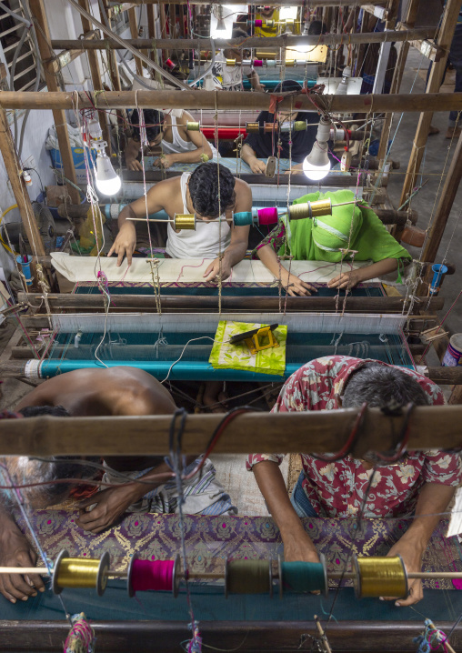 Bangladeshi people weaving in a sari factory, Dhaka Division, Rupganj, Bangladesh