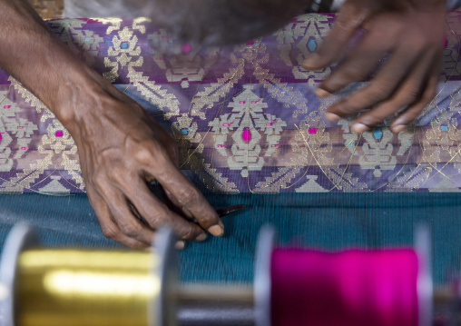 Bangladeshi man weaving in a sari factory, Dhaka Division, Rupganj, Bangladesh