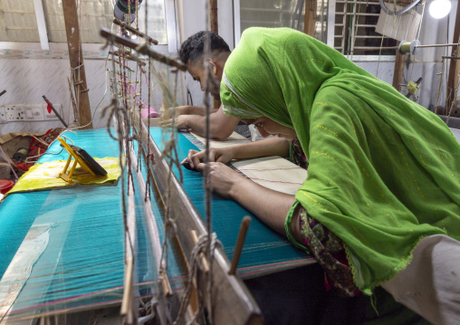 Bangladeshi people weaving in a sari factory, Dhaka Division, Rupganj, Bangladesh