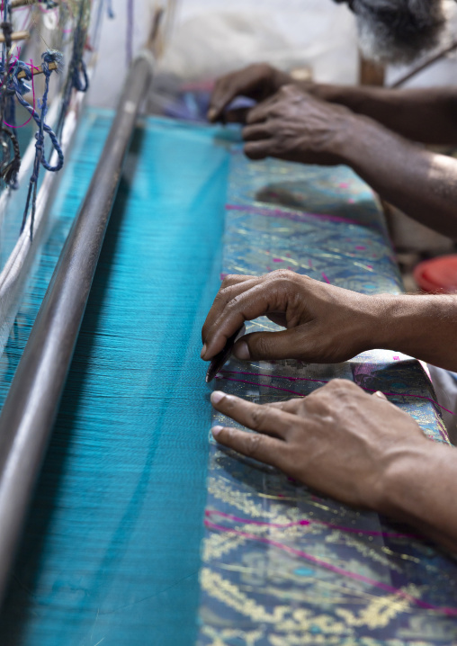 Bangladeshi people weaving in a sari factory, Dhaka Division, Rupganj, Bangladesh