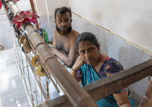 Bangladeshi couple weaving in a sari factory, Dhaka Division, Rupganj, Bangladesh