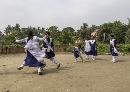 Bangladeshi girls in school uniforms playing, Dhaka Division, Rupganj, Bangladesh