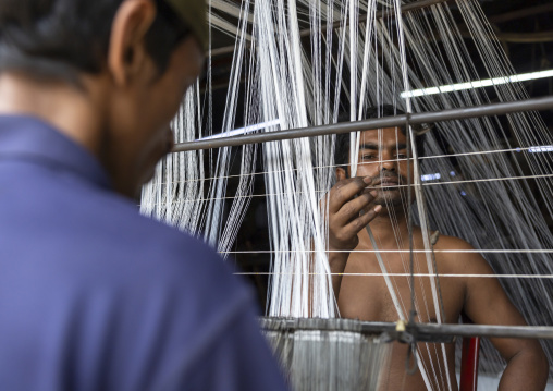 Bangladeshi men working on a textile factory looms, Dhaka Division, Rupganj, Bangladesh