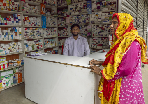 Bangladeshi woman buying medecine in a pharmacy, Dhaka Division, Rupganj, Bangladesh