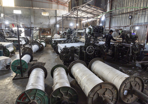 Bangladeshi man working in a textile factory, Dhaka Division, Rupganj, Bangladesh