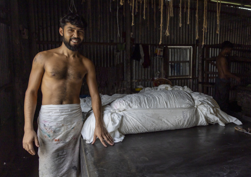 Bangladeshi worker in a block printing factory, Dhaka Division, Rupganj, Bangladesh