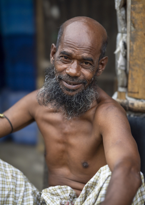 Portrait of a smiling shirtless bangladeshi man, Chittagong Division, Chittagong, Bangladesh