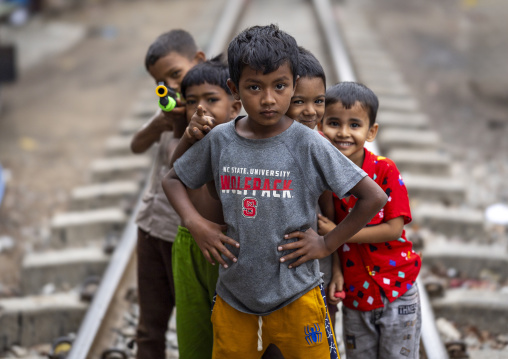 Bangladeshi boy posing along a railway track, Chittagong Division, Chittagong, Bangladesh