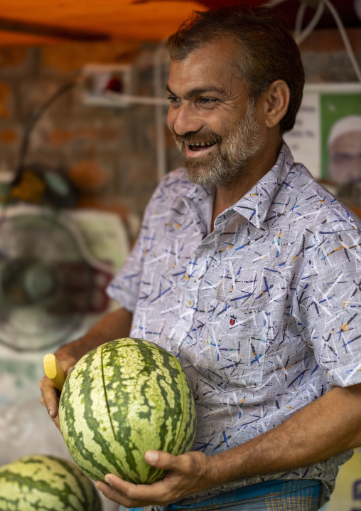 Bangladeshi man selling watermelons at Jhautola market, Chittagong Division, Chittagong, Bangladesh