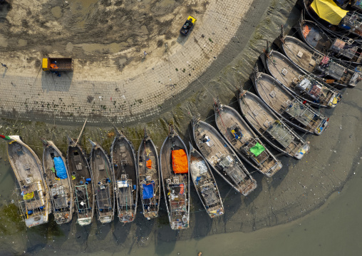 Aerial view of trawlers anchored in front of the fish market, Chittagong Division, Chittagong, Bangladesh