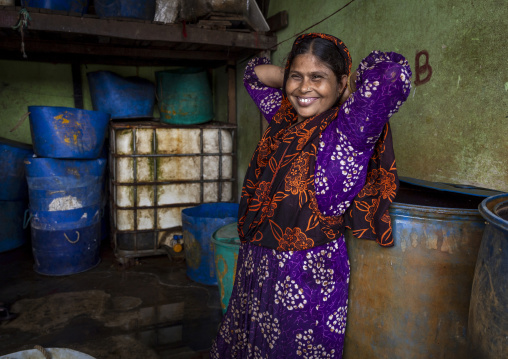 Portrait of a smiling bangladeshi woman at fish market, Chittagong Division, Chittagong, Bangladesh