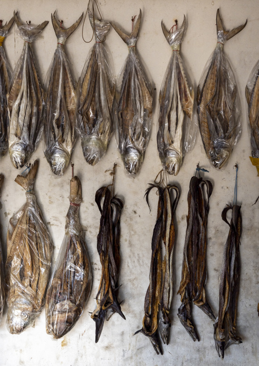 Dry fishes hanging on a wall for sale, Chittagong Division, Cox's Bazar Sadar, Bangladesh