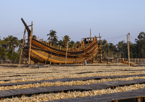 Moon fishing boat building in front of dried fishes, Chittagong Division, Cox's Bazar Sadar, Bangladesh