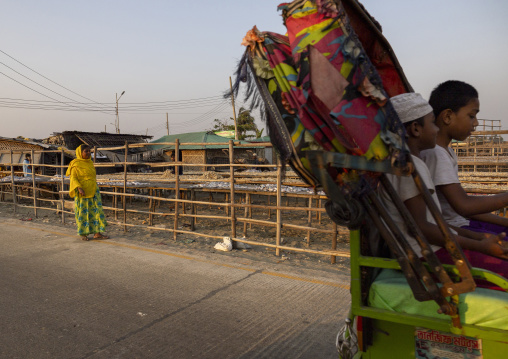 Rickshaw passing in front of fish drying in the sun, Chittagong Division, Cox's Bazar Sadar, Bangladesh