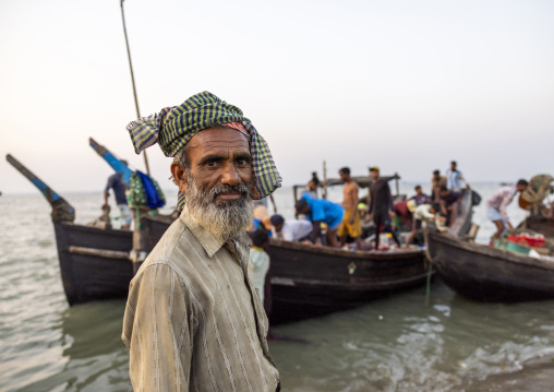 Portrait of a bangladeshi fisherman near trawlers, Chittagong Division, Cox's Bazar Sadar, Bangladesh