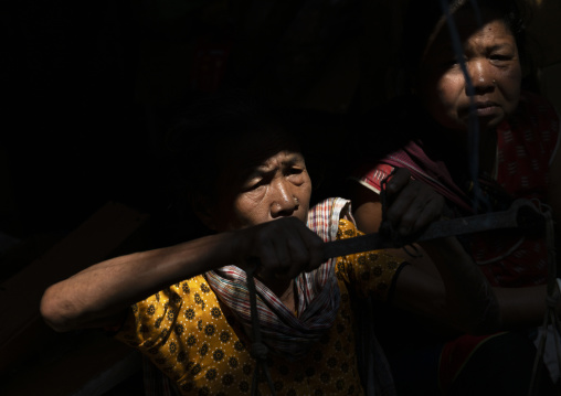 Chakma tribe women in a ray of light, Chittagong Division, Rangamati Sadar, Bangladesh