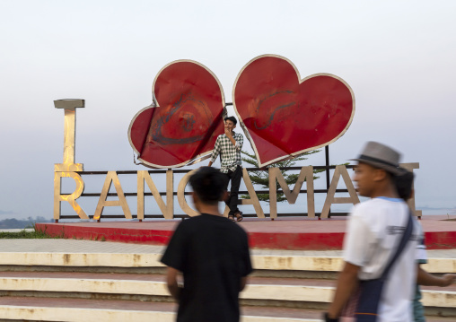 Tourists taking pictures in front of a Rangamati giant billboard, Chittagong Division, Rangamati Sadar, Bangladesh