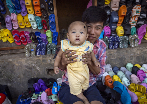 Father with his baby son at Chakma tribe market, Chittagong Division, Rangamati Sadar, Bangladesh