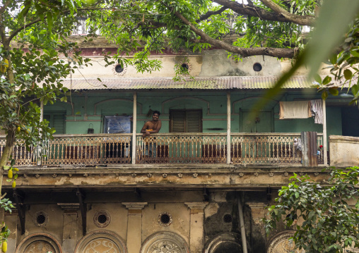 Bangladeshi man standing on the balcony of an heritage house, Dhaka Division, Tongibari, Bangladesh