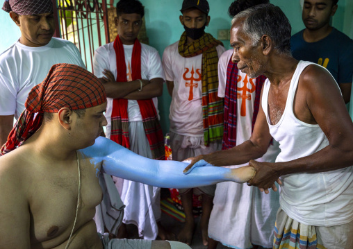 Make up of a hindu devotee who becomes Lord Shiva at Lal Kach festival, Dhaka Division, Tongibari, Bangladesh