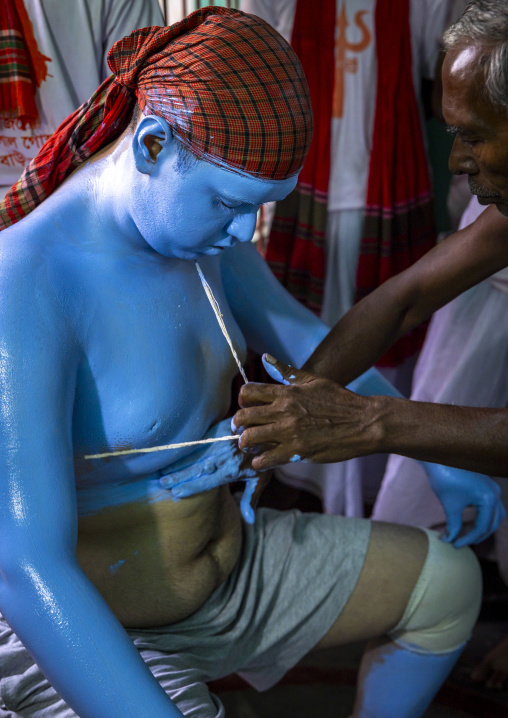 Make up of a hindu devotee who becomes Lord Shiva at Lal Kach festival, Dhaka Division, Tongibari, Bangladesh