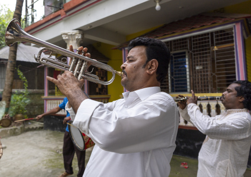 Bangladeshi musicians playing during a hindu ceremony, Dhaka Division, Tongibari, Bangladesh