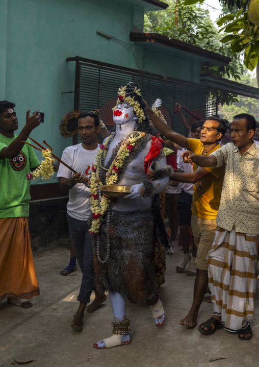 Lord Shiva procession with devotees at Lal Kach festival, Dhaka Division, Tongibari, Bangladesh