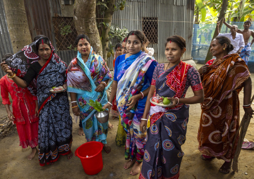 Hindu women waiting Lord Shiva to offer food at Lal Kach festival, Dhaka Division, Tongibari, Bangladesh