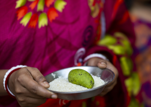 Hindu woman waiting Lord Shiva to offer food at Lal Kach festival, Dhaka Division, Tongibari, Bangladesh