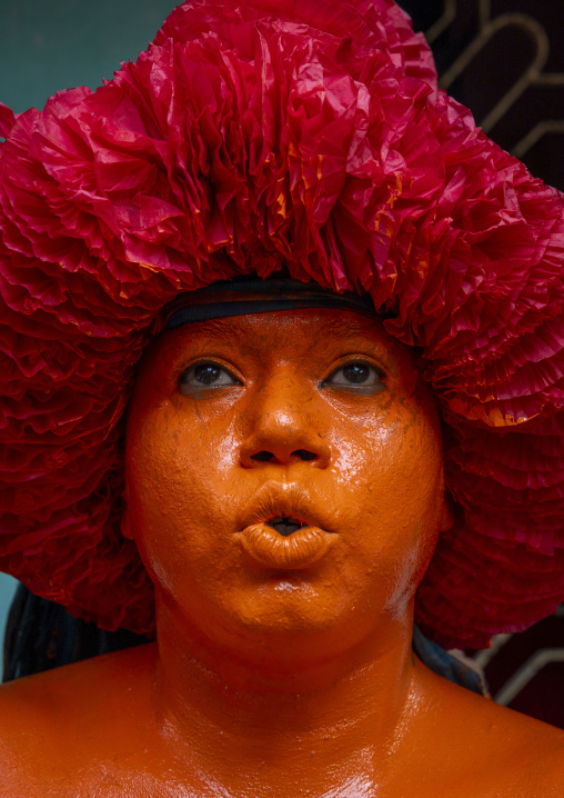 Portrait of a Hindu devotee covered with orange color in Lal Kach festival, Dhaka Division, Munshiganj Sadar, Bangladesh