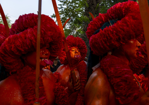 Hindu devotees covered with orange color in Lal Kach festival, Dhaka Division, Munshiganj Sadar, Bangladesh