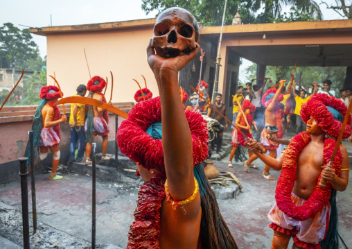 Portrait of a Hindu devotee covered with orange color in Lal Kach festival, Dhaka Division, Munshiganj Sadar, Bangladesh