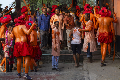 Hindu devotees covered with orange color in Lal Kach festival, Dhaka Division, Munshiganj Sadar, Bangladesh